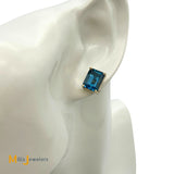 14K Yellow Gold 8.94ctw Emerald Cut Blue Topaz Stud Earrings