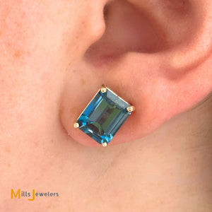 14K Yellow Gold 8.94ctw Emerald Cut Blue Topaz Stud Earrings