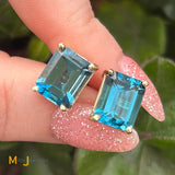 14K Yellow Gold 8.94ctw Emerald Cut Blue Topaz Stud Earrings